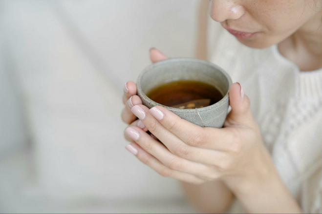 Woman holding a cup of tea