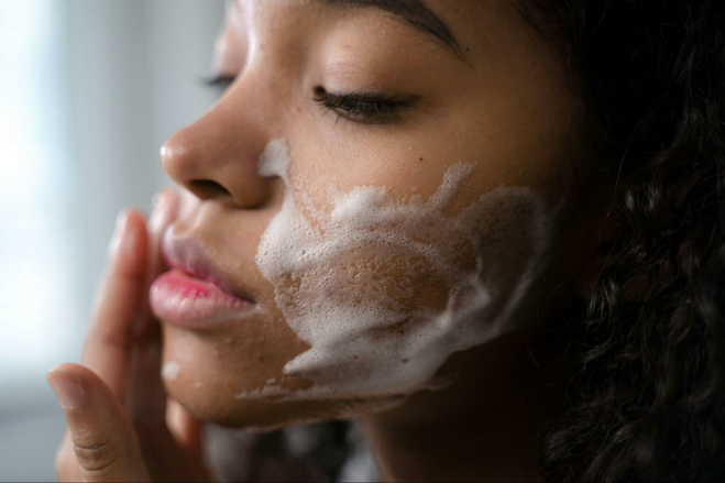 Woman washing her face