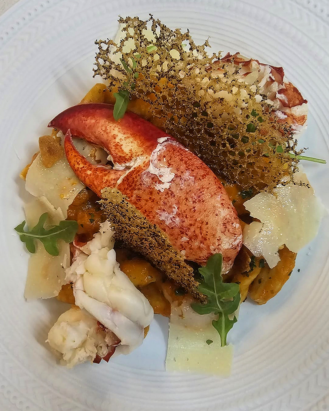 Lobster pasta dish with fresh parmasean, fennel and crisp tuile.