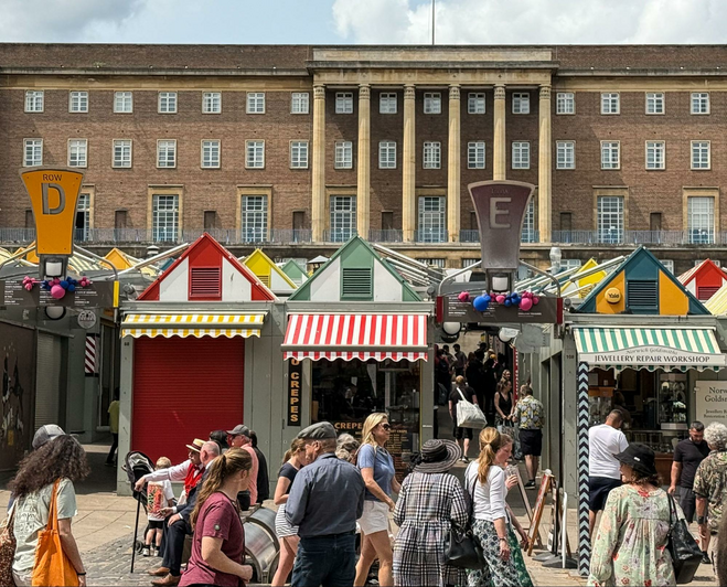 Norwich Market in the city centre is a popular place for lunchtime snacks and shopping, in front of Norwich City Hall.