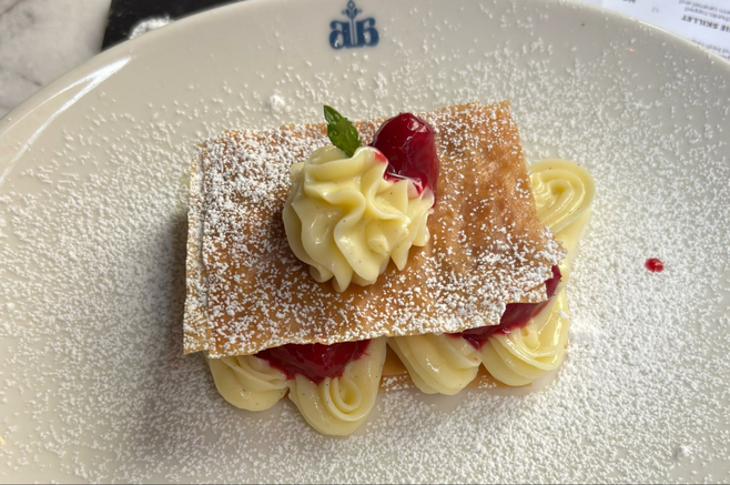 A pastry filled with raspberries and custard cream.