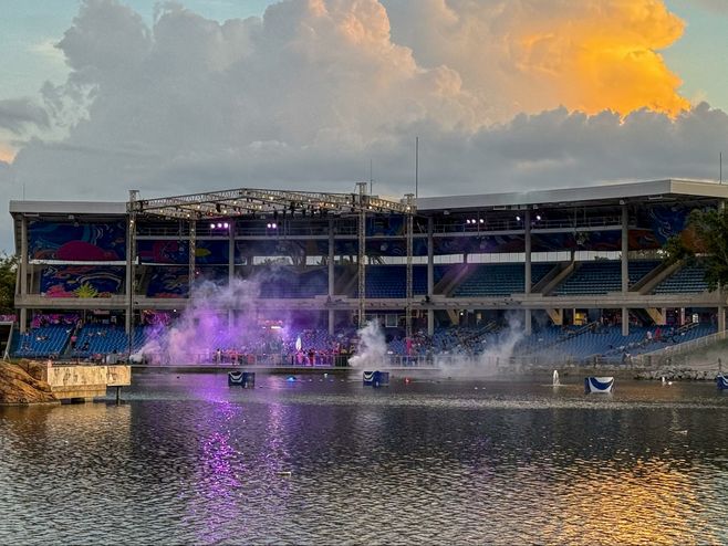Bayside stadium at sunset with patrons arriving for an event.