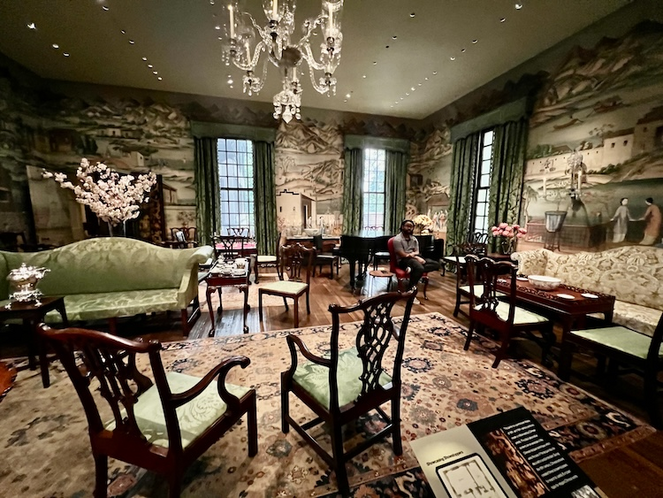 Interior room at Winterthur Museum featuring Chinese motif wallpaper and period furnishings.