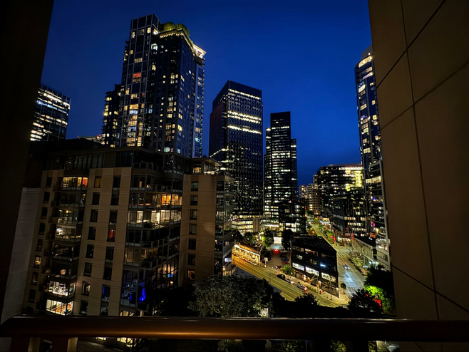 View of the Seattle skyline from the 1 Hotel Seattle, lots of lighted skyscrapers.
