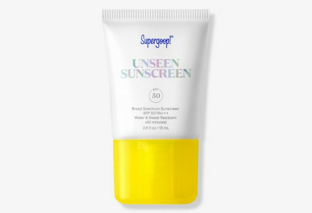 Photo of squeeze bottle of Supergoop Unseen Sunscreen in a white bottle with bright yellow cap.