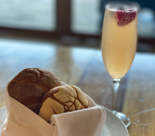 Mexican pastries served with a mimosa