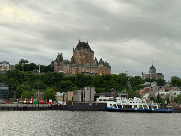 Riverfront with ferry docked. In the background the Fairmont Chateau Frontenac