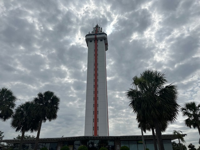 Picture of the Citrus Tower known for its orange and white stripe. 