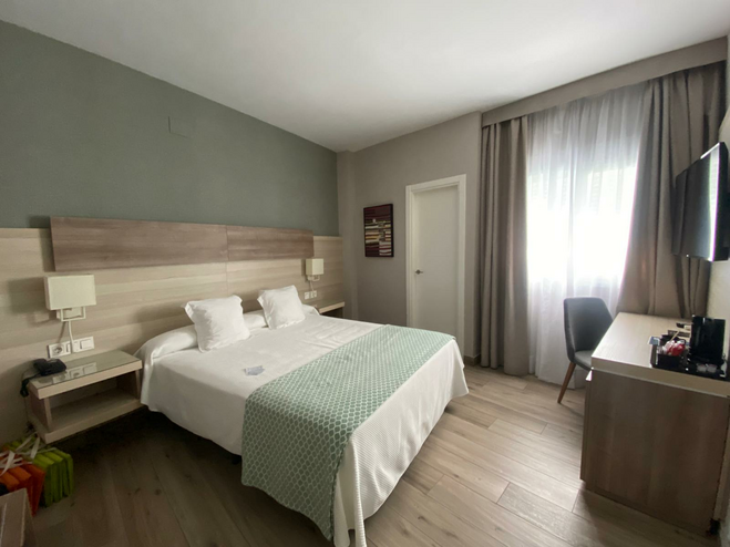 Hotel bed and desk