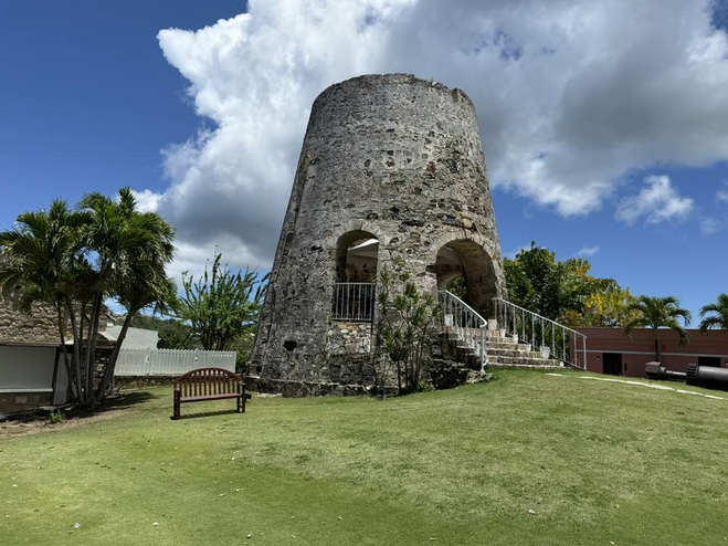 Old sugar mill, a towering structure made of stone, on the Buccaneer's grounds.