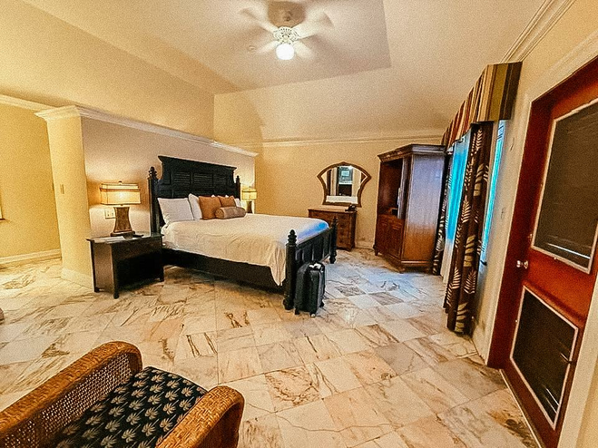 Large bedroom with king bed and marbel floors