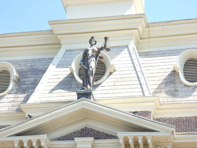 Statue of Lady Justice atop the Scott County courthouse.