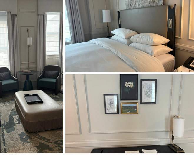 A cool-tone living room with a couch, table, and two chairs. A taupe bedroom with a king-size bed with white sheets and pillows. A writing desk with a book, four photos on the wall, and a lamp on the desk.