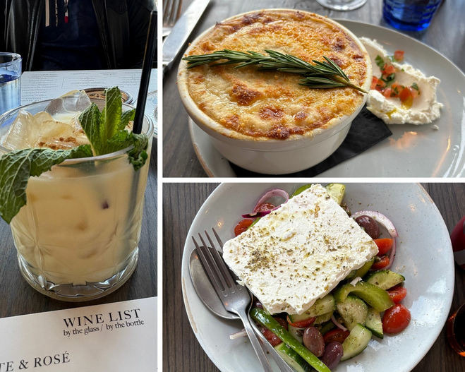 A white dish filled with a Greek salad with olives, cucumbers, tomatoes, and onions with feta cheese block on top. A white plate with a cheese soufflé and rosemary sprig. A cream colored drink in a glass with a sprig of mint and nutmeg sprinkle.