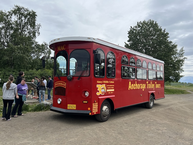 Anchorage Red Trolley making a stop with visitors ready to board. 
