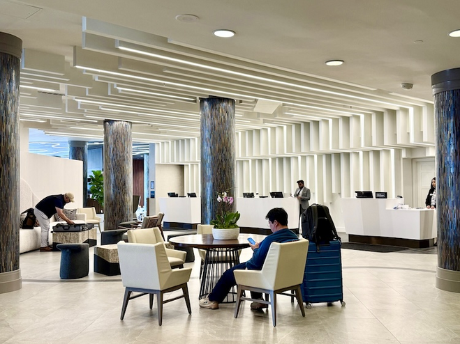 Renovated Anchorage Hilton lobby with modern light color and wood columns. 