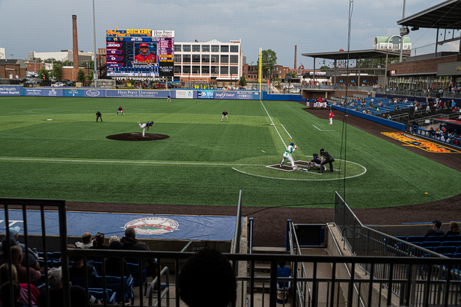 A batter poised to hit an incoming pitch
