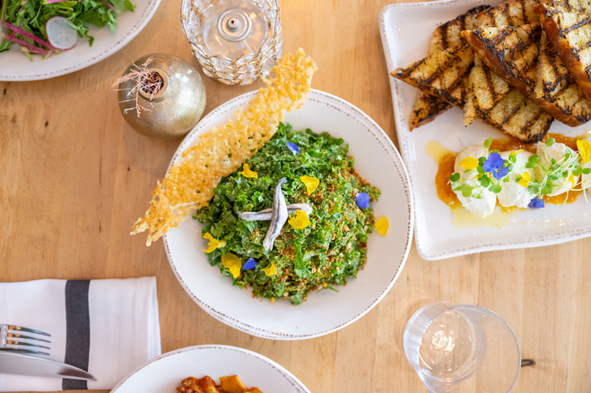 A bowl of kale crumb salad with anchovies and parmesan crisp from Ever Analdo restaurant. 