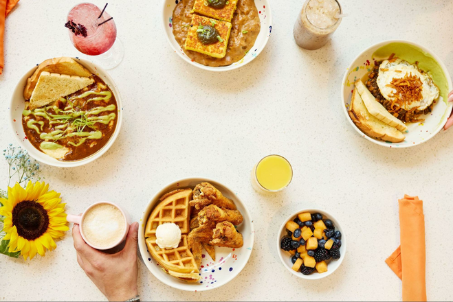 An overhead shot of brunch dishes from Uptown Yolk in Charlotte, NC