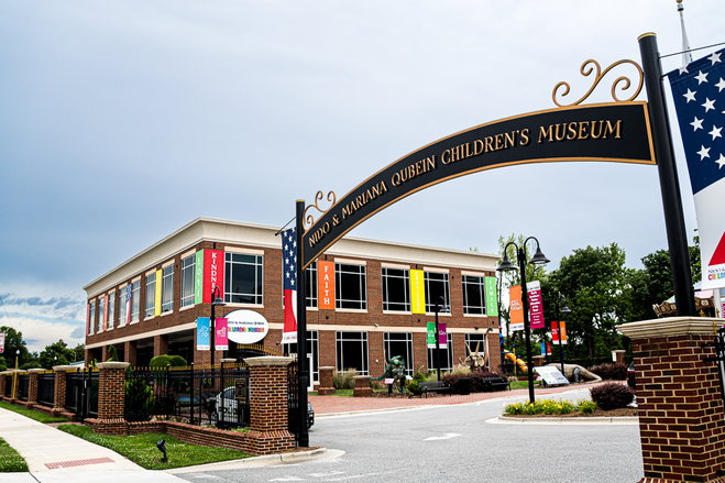 Metal arch over driveway and museum building