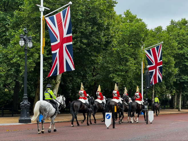 Soon after 10:30am each day be on the lookout for The King's Life Guard of five horses and horsemen start clomping along on The Mall in London on their way to Horse Guards Parade.  In front and behind them are London police also on horses.