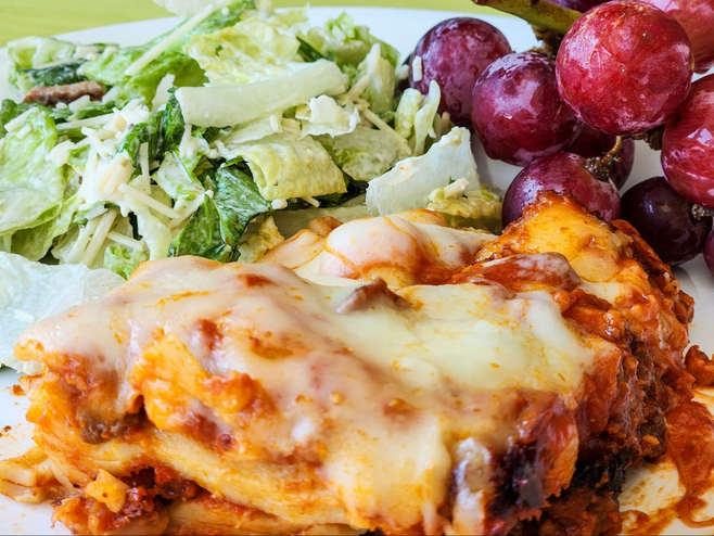 Lasagna and Caesar salad lunch plate served on a whale watching cruise in the San Juan Islands.