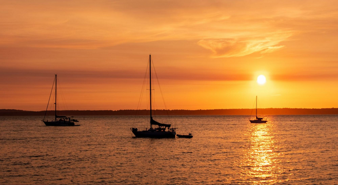 Boats on the bay at sunset