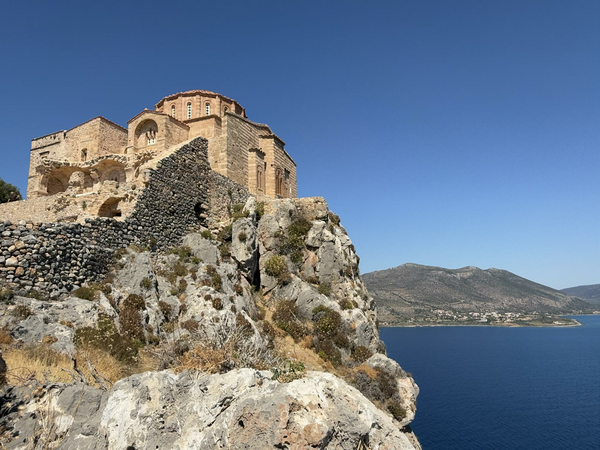 Old church on cliff overlooking coast.