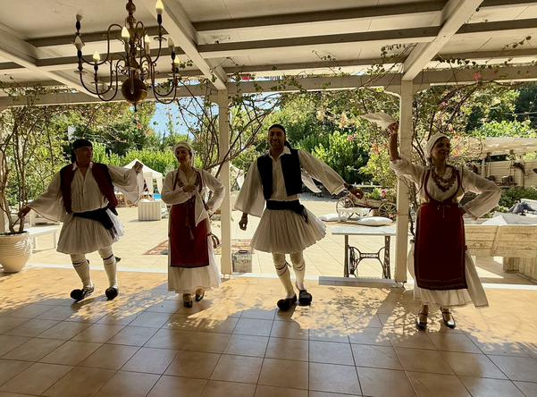 Four people dancing traditional folk dance.