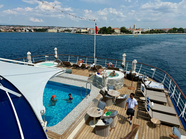 Looking out over the ship's swimming pool and lounge area.