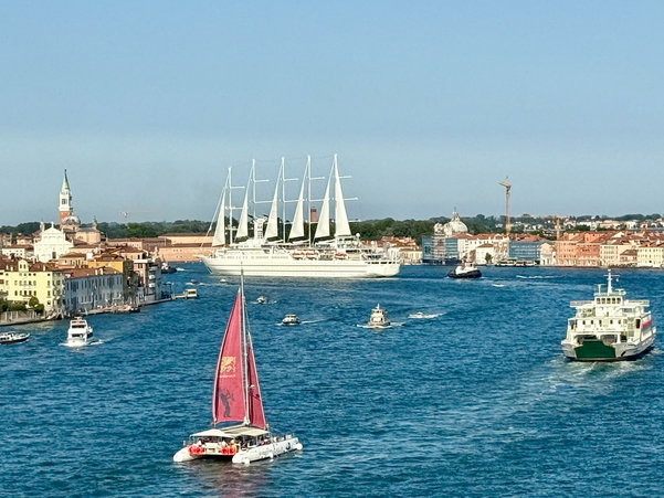 Small cruise ship sailing into Venice Italy.