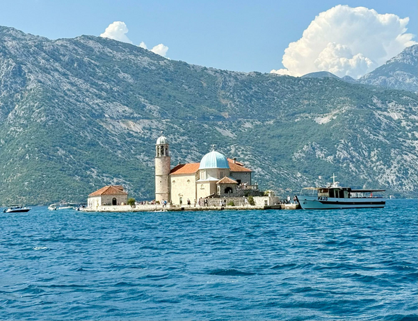 A small church takes up an entire island in harbor.