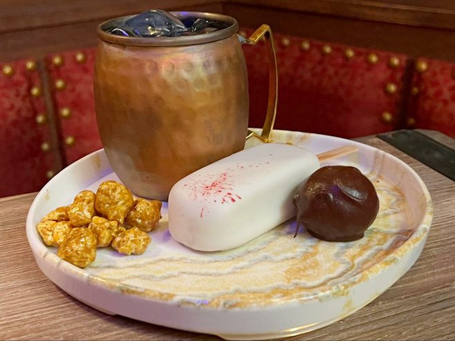 The Treasure Trove drink and dessert plate at The Beak and Barrel.