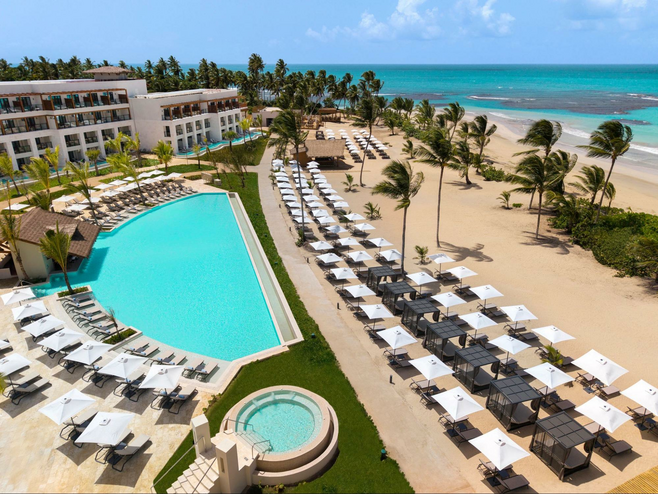 Resort with turquoise pool and sand at Dominican Republic family friendly all-inclusive