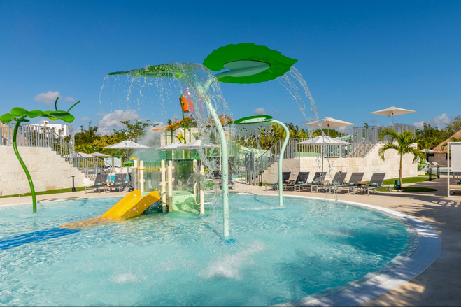 Blue sky and water at kids' splash playground at Paradisus family all-inclusive, Mexico