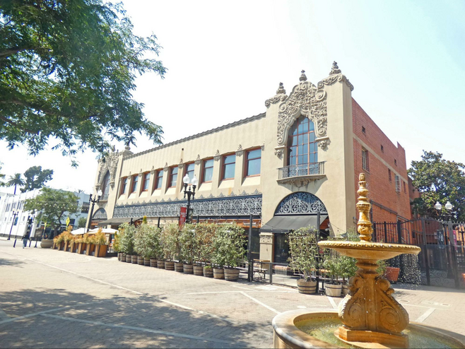 The two story tan Santora Building with elaborate Churrigueresque decoration in the Artists Village.
