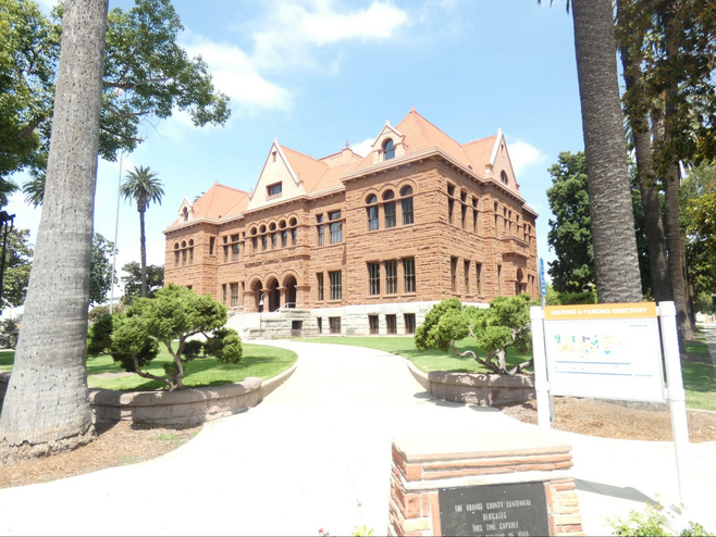 A red brick three story Art Deco building.