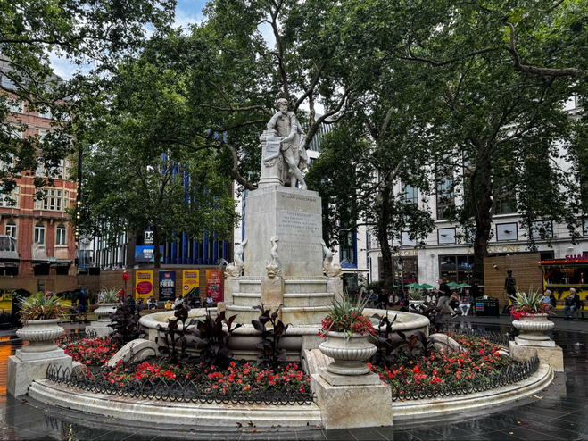 Leicester Square's main fountain features a well known statute of William Shakespeare. Because it's also a well known destination for tourists, the area is well patrolled by London police and by almost any measure, safe to walk around day or night.