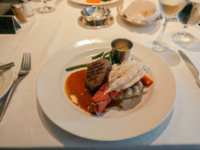 Surf and turf in main dining room on board Discovery Princess in Alaska