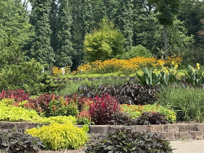 The park system in Columbia, Missouri, includes many local hiking and cycling trails adorned with beautiful landscaping and flower gardens at trailheads.