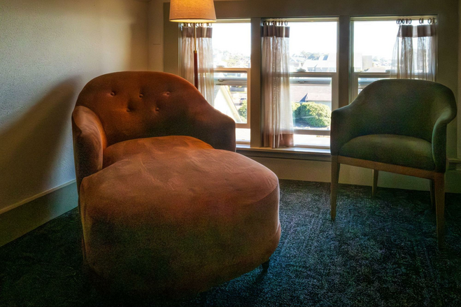 Chaise lounge beside a window at Hotel Sylvia, Newport, Oregon