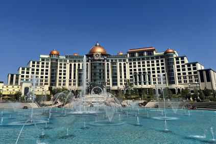 Large fountain with Universal Helios Grand Hotel in the background.