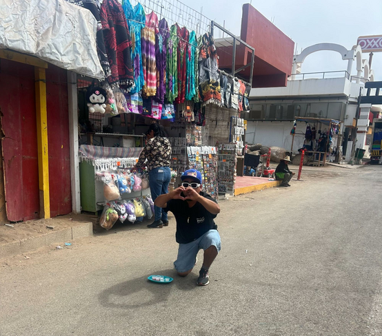 Local store owner making a heart with his hands to us because we spoke in Spanish to him!