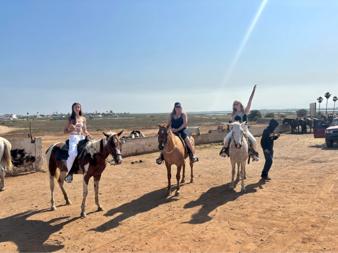 My mom, my sister, and I pictured riding horseback.