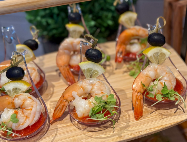 Shrimp with cocktail sauce and garnish