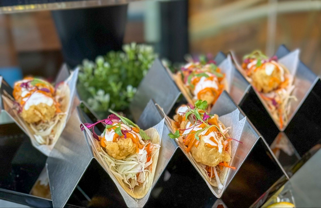 fried fish tacos on a serving plate