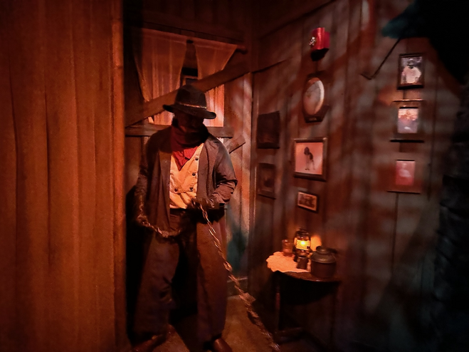 A chain-wielding cowboy in a haunted house