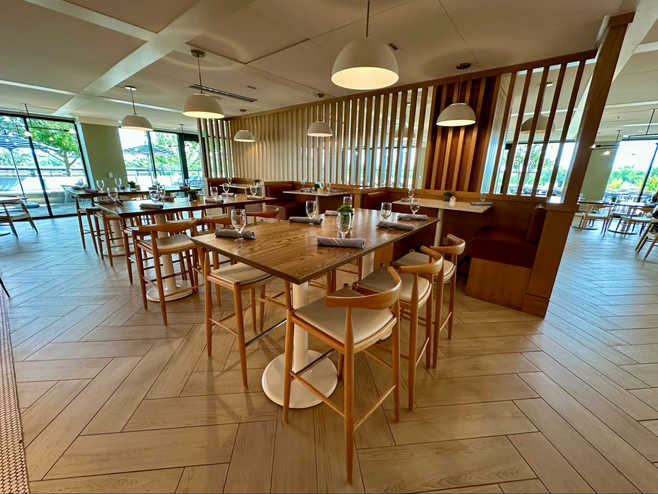 Bright interior of The Apron, a casual dining option at the Omni PGA Frisco Resort in Texas.