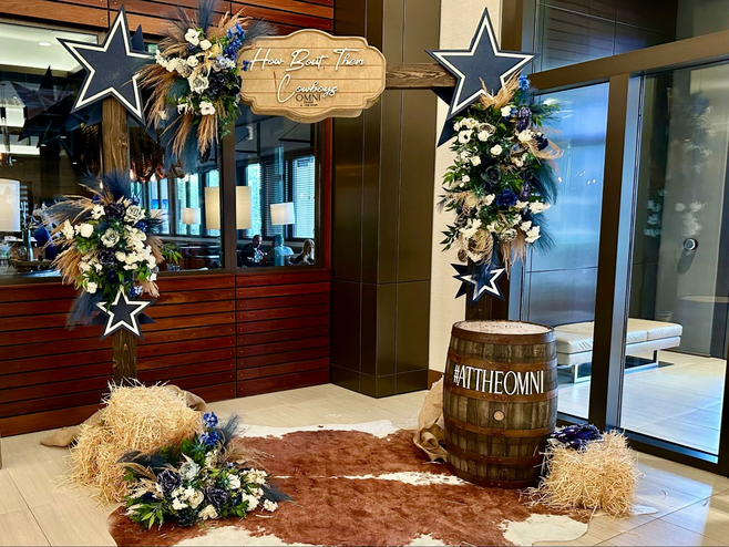 A Dallas Cowboy theme Instagram set for photos in the Omni Frisco hotel lobby features the Cowboys' blue star logos and a cowhide rug.