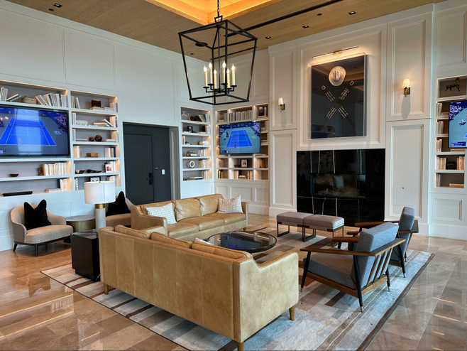 The Library at the Omni PGA Frisco has comfy couches, multiple tvs and a fireplace.